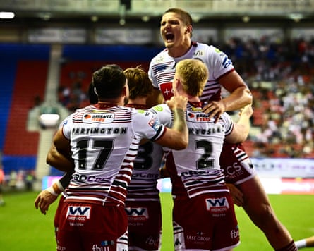 Wigan’s Adam Keighran celebrates a try against St Helens