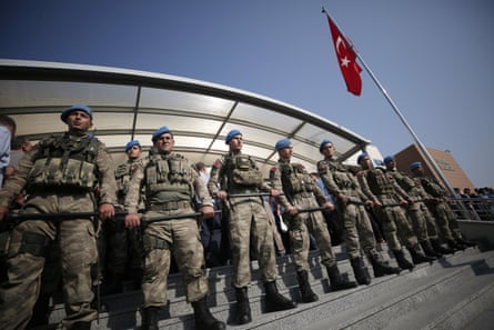 Turkish army soldiers stand guard outside a court in Silivri.