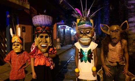 Parade hits … masked revellers at Xilitla’s Xantolo celebrations.