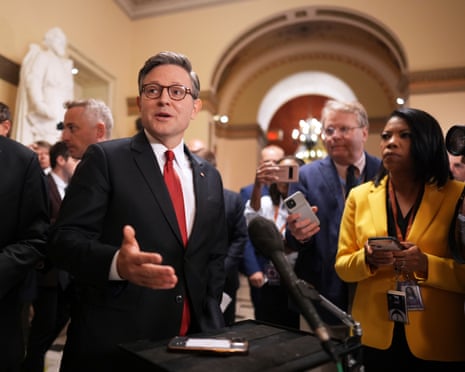 Mike Johnson speaks to reporters as he heads to the chamber.