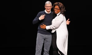 Namaste ... Tim Cook, CEO of Apple, and Oprah Winfrey hug during a special event at the Steve Jobs Theater in Cupertino.