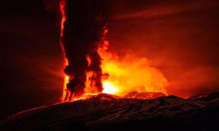 Fire and ash emissions spew from Mount Etna’s Voragine crater.