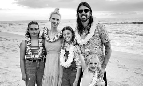 ‘Genial and enthusiastic’: Dave Grohl with wife, Jordyn, and their children at the beach.
