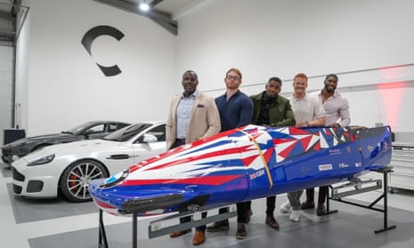 (Left to right): Lamin Deen, Ben Simons, Joel Fearon, Greg Rutherford and Toby Olubi pose with their new GB bobsleigh sled at Callum Designs.