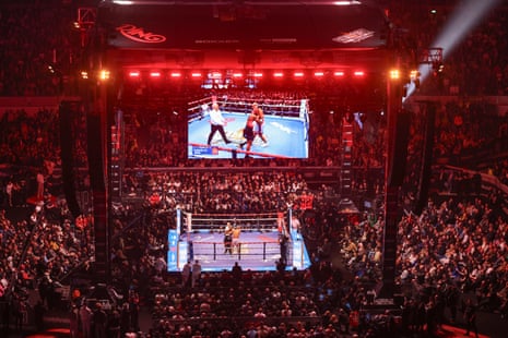 Spectators at a packed Tottenham Hotspur Stadium look on as Conor Benn and Chris Eubank Jr. fight during their “Fatal Fury” billed fight in April.