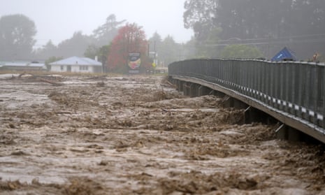 Redcliffe Bridge is closed off as debris piles up along the Tutaekuri River in Napier, New Zealand.