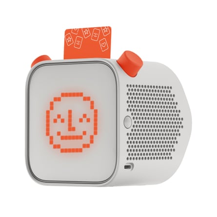 Square white audio player with computerised image of arange smiley face on the side