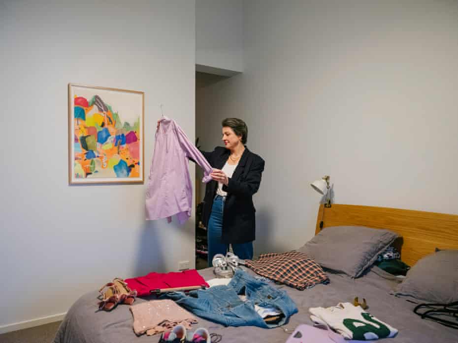 Amelia Crook looking through clothes at home in Kyneton, Victoria