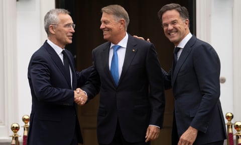 The Romanian president, Klaus Iohannis (centre), who is standing for the post, with Mark Rutte (right) and the current secretary general, Jens Stoltenberg in June 2023.