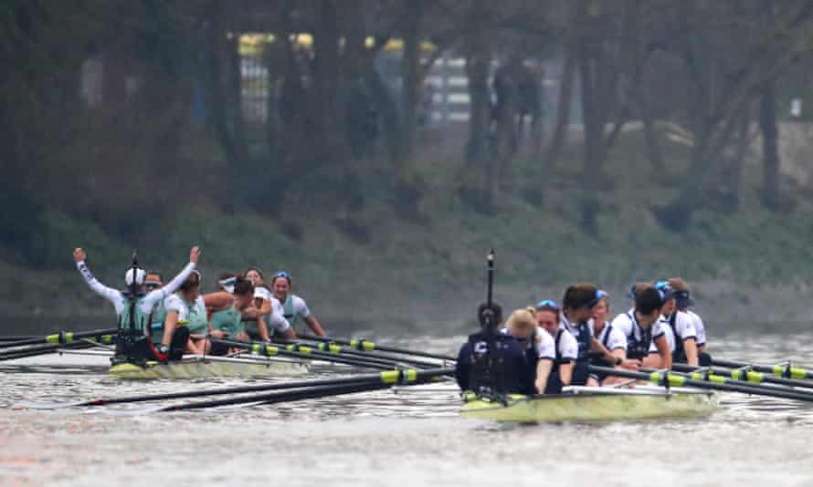 The Cambridge crew, left, celebrate as they cross the line to win the race.
