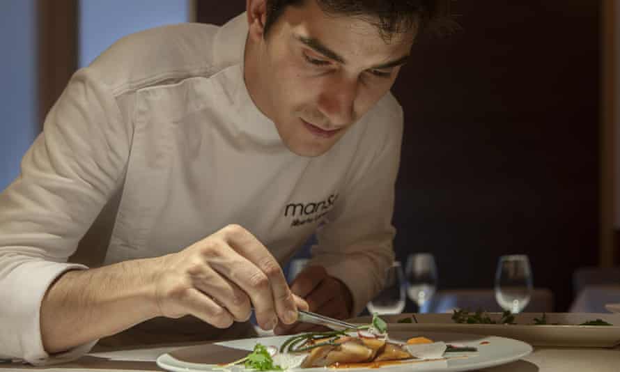 Chef Alberto Lareo plates a meal at his restaurant, Manso.