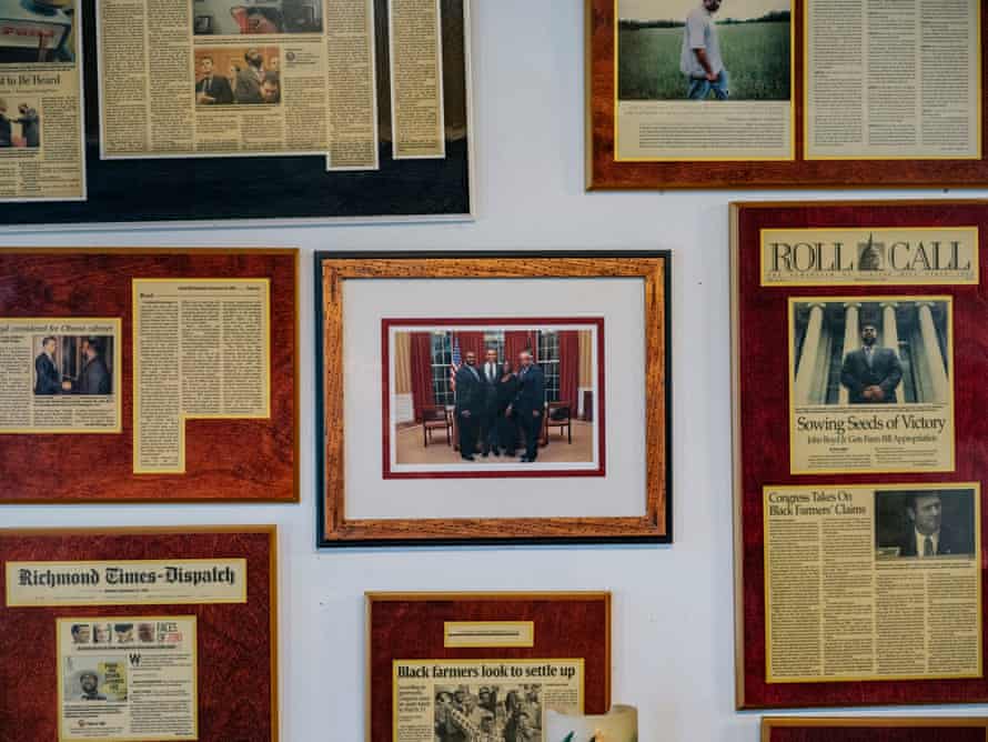 John Boyd Jr’s home is decorated with stories and photos of his trips to Washington DC to meet with lawmakers and presidents in his fight for black farmers’ rights.