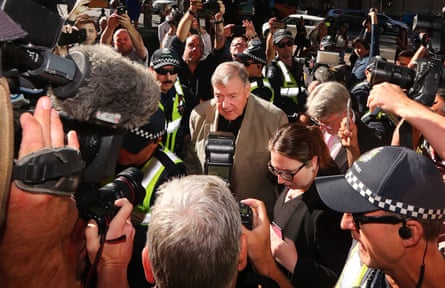 George Pell surrounded by police and reporters