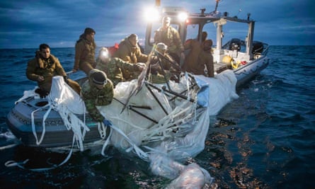 US Navy sailors recover a Chinese high-altitude surveillance balloon off the coast of South Carolina on February 5.