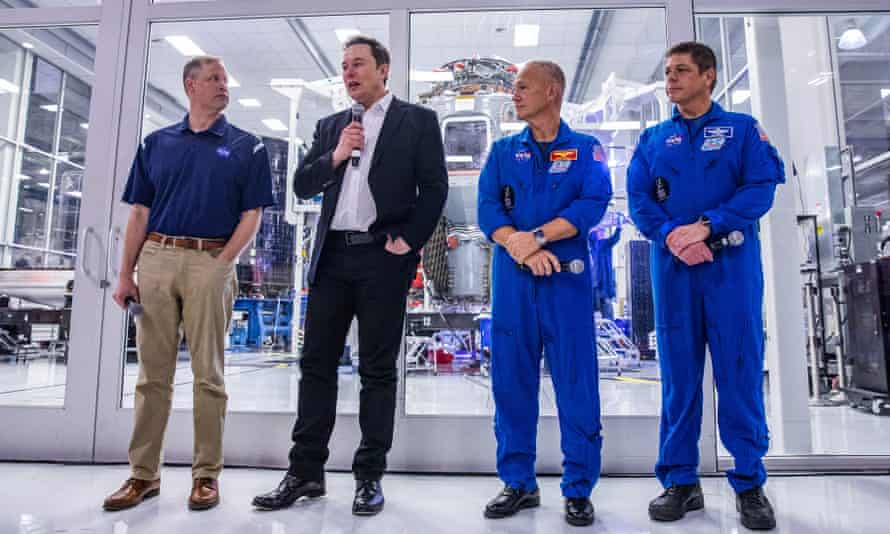 Elon Musk with Nasa’s Jim Bridenstine (left) and astronauts Doug Hurley and Bob Behnken at SpaceX HQ in California