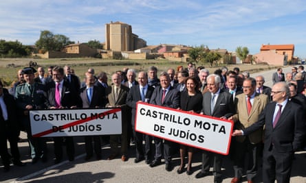 Officials and campaigners holding village’s new road signs reading ‘Castrillo Mota de Judíos’.