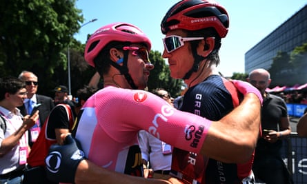 Primoz Roglic (left) embraces Geraint Thomas ahead of the final stage.
