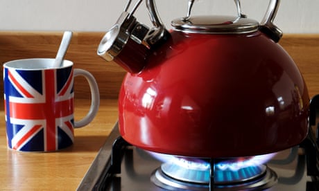 Gas kettle on hob, with a mug nearby