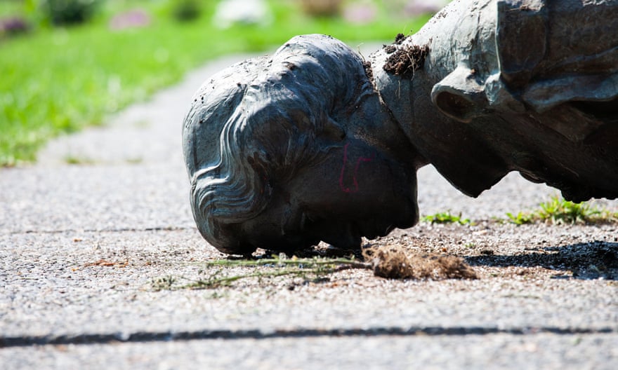 A toppled statue of Queen Elizabeth II lies face down on the grounds of the Manitoba legislature on 2 July 2021 in Winnipeg. The statue was pulled down by Indigenous protesters after a march to honour survivors and victims of Canada’s residential school system.