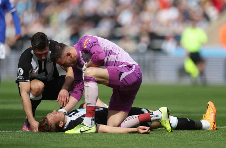 Dan Burn goes down after the collision.