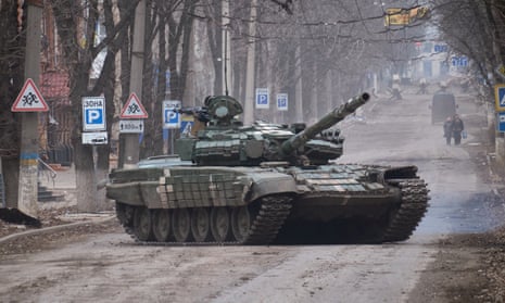 A Ukrainian tank drives in the centre in the frontline city of Bakhmut, Ukraine.