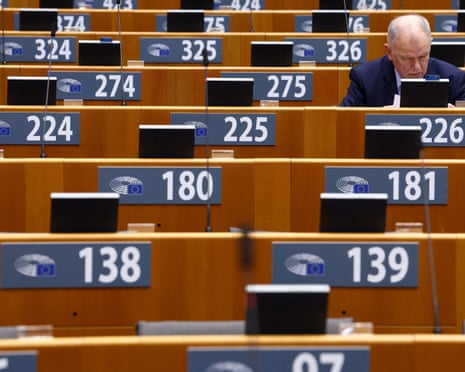 A member of the European Parliament looks on before a debate on the EU-US trade deal, in Brussels, Belgium.