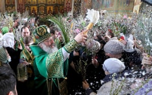 The Metropolitan Kirill of Yekaterinburg and Verkhoturye splashes holy water during the liturgy at the Cathedral of the Holy Trinity in Yekaterinburg, Russia on Orthodox Palm Sunday