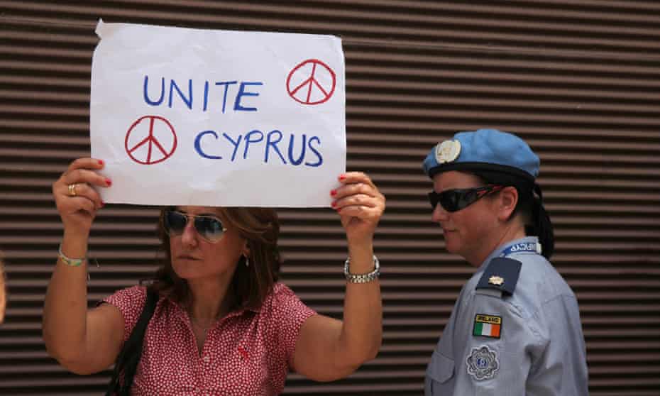 A woman stands beside a UN peacekeeper