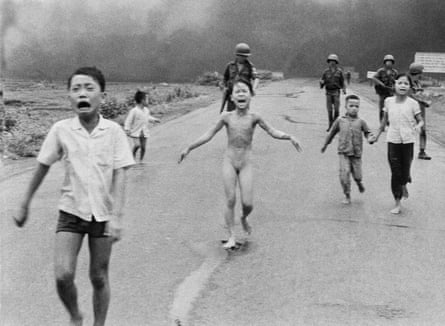 children scream as the run on a road