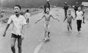 iconic image of Kim Phuc, a naked and badly burnt Vietnamese girl running  from a napalm attack