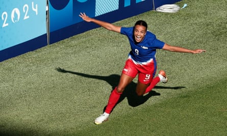 Mallory Swanson celebrates her goal against Brazil at the Olympics.