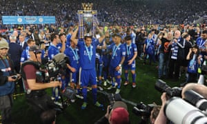 Leicester City players lift the Premier League trophy at a packed King Power Stadium.