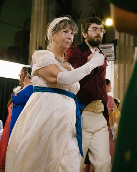 A man and a woman holding hands and dancing