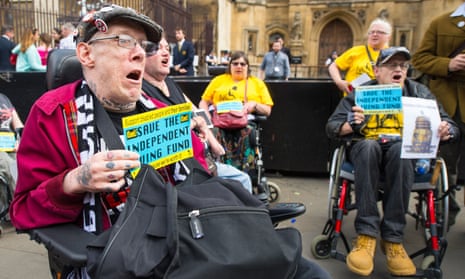 People in wheelchairs protesting outside parliament on 24 June 2015