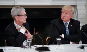 Apple president Tim Cook with Donald Trump. Activists have urged Cook not to hold talks with the president.
