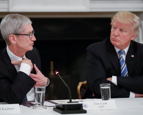 two men in suits talk with each other