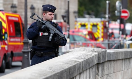 French police and security forces establish a security perimeter near the Paris police HQ where four staff were killed