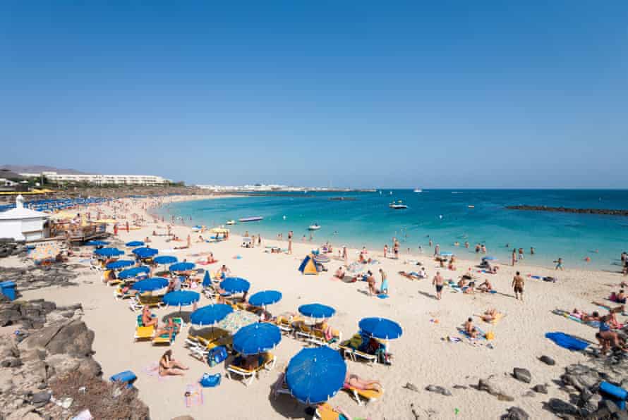The crowded main beach at Playa Blanca on Lanzarote before the Covid-19 outbreak.