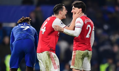 Arsenal’s Granit Xhaka embraces Hector Bellerín at the full-time whistle beside a dejected Tammy Abraham.