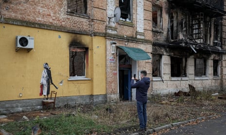 A new graffiti in Banksy’s signature style, although not posted by the artist on social media, is seen on the wall of a destroyed building in the Ukrainian town of Hostomel, which had been occupied by Russia until April and heavily damaged by fighting.