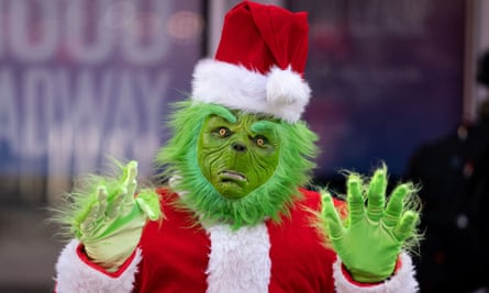 A person dressed as the Grinch in New York City.