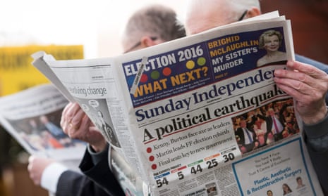 A man reads the Sunday Independent newspaper in Dublin on 28 February 2016