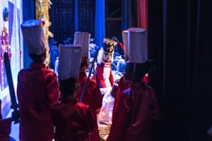 Some of the dancers prepare to go onstage while George is performing in the lead role
