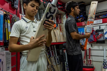In New Ahmedabad Sports, Mumbai’s most renowned sports and cricket supply shop and one of the oldest with over 85 years’ experience , two brothers are examining bats. The prices of bats are from INR 5,000 (£47) and can go up to INR 200,000 (£1,897), depending on the quality of the wood and the style.