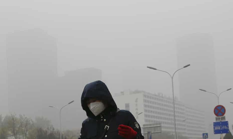 A woman wearing a mask in Beijing