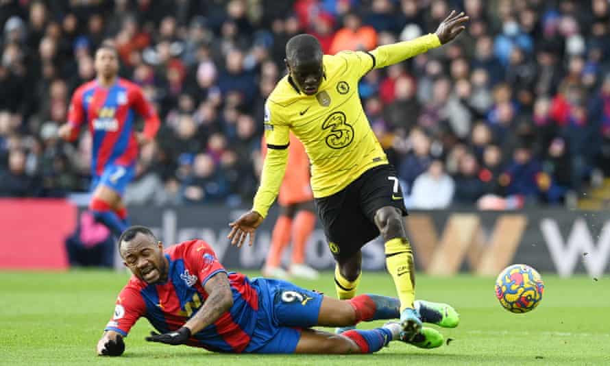 Ngolo Kante of Chelsea runs with the ball from Jordan Ayew of Crystal Palace during the Premier League at Selhurst Park.