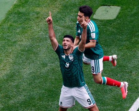 Raúl Jiménez points up to the sky after he scores