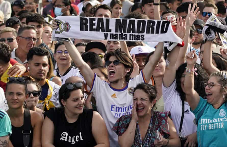 Real Madrid supporters greet their returning heroes