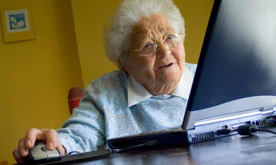 An older woman using her laptop computer at home