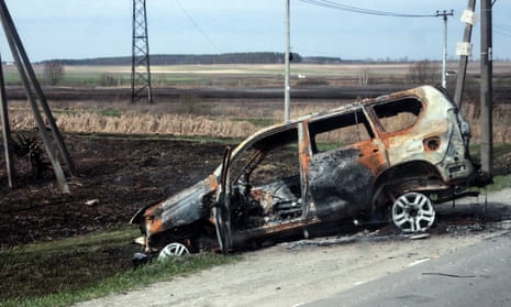 A damaged car is seen in Hostomel, Kyiv region, Ukraine, in April.